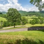condos for sale in Blowing Rock, NC with a view, Blowing Rock NC condos, Blowing Rock condos for sale, NC Mountain Properties, Madi Doble, Green grass, green trees, rolling hills, Blue Ridge Mountains, Smoky Mountains, land for sale in Boone, Boone land for sale
