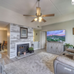 condos for sale in Blowing Rock, North Carolina, NC Mountain Properties, Madi Doble, living room with lights on, fireplace, arm chairs, Blowing Rock, NC realtor, Blowing Rock real estate for sale