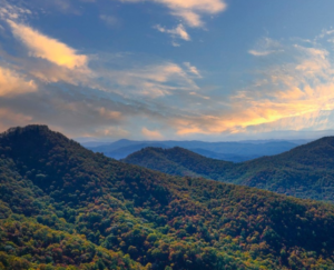 a beautiful view of the NC mountains, shown as the sun is starting to set